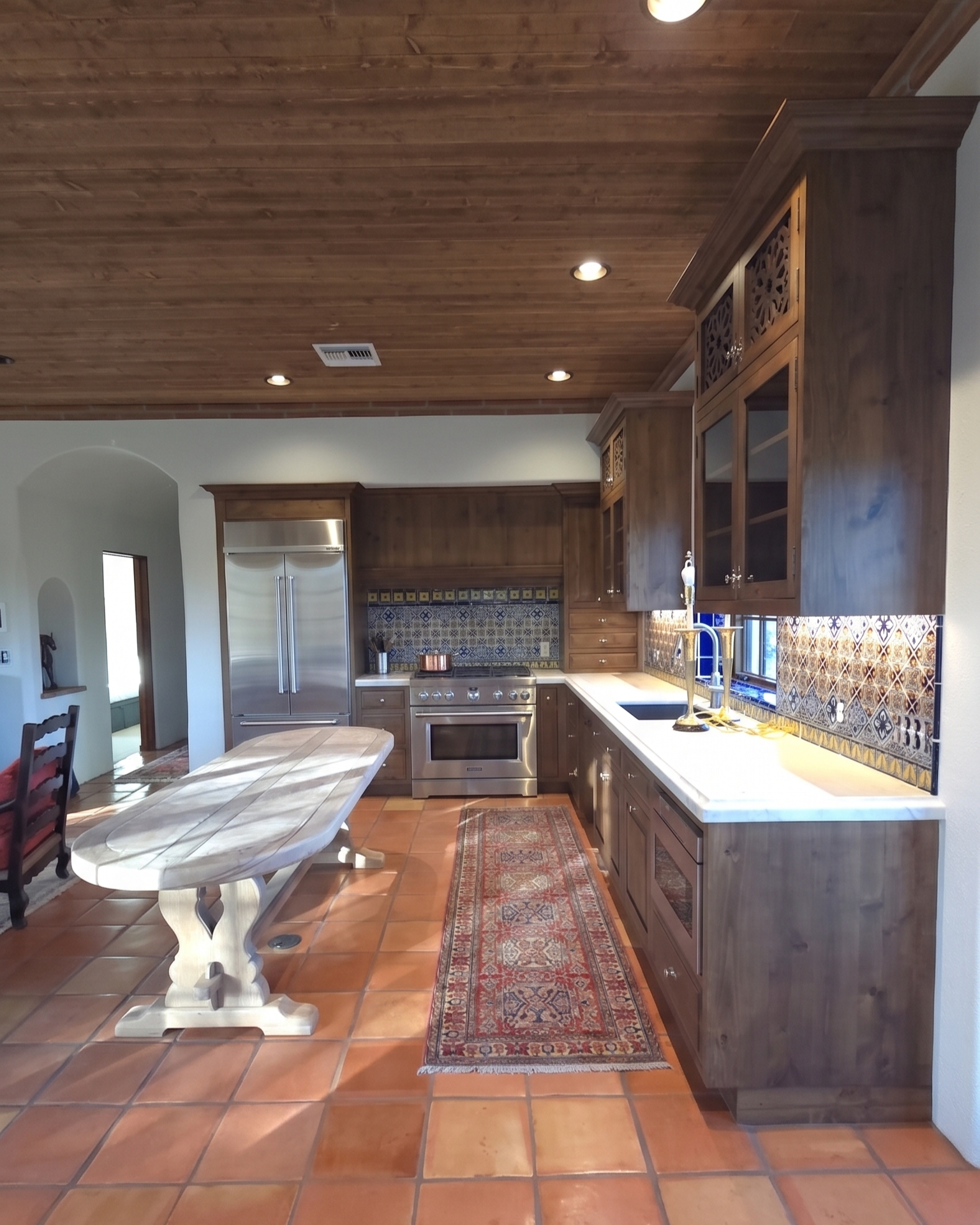 Custom kitchen cabinetry with built-in appliances — Westgate Woodworks